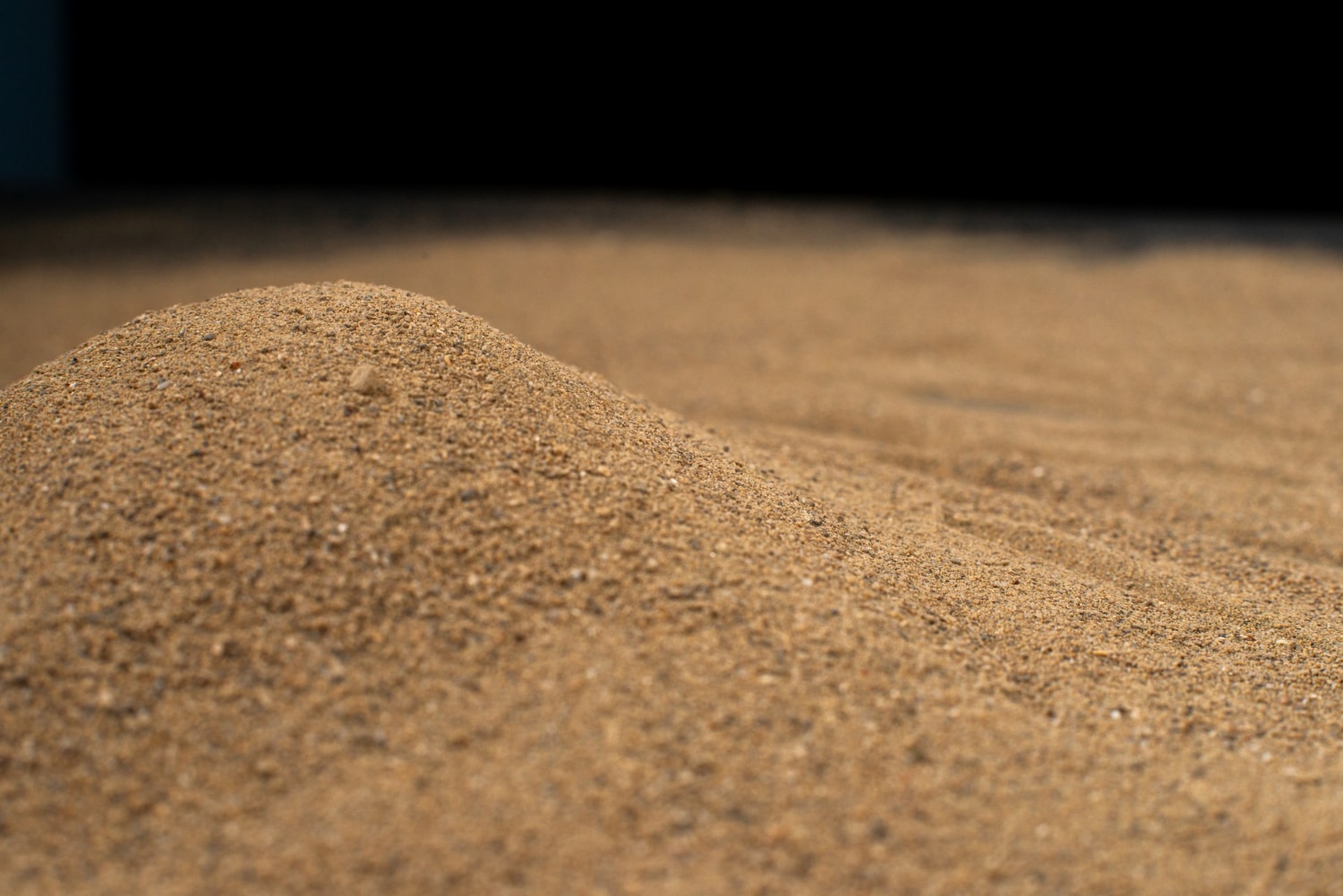 Brown Sand Surface Black Wall